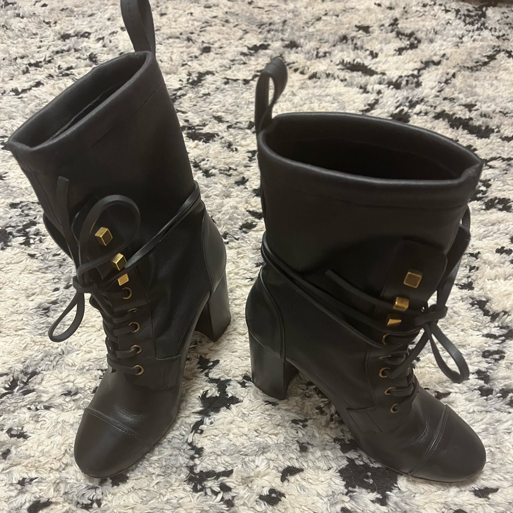 Stuart Weitzman black leather heeled combat boot. Size 6. Worn 1x.